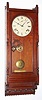 C.1883, Seth Thomas Clock Co., QUEEN ANNE, cherry cased wall clock, 8-day time and gong strike, spring.