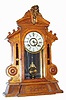 C.1890, New Haven Clock Co., "CORSAIR", golden oak cased parlor clock, 8-day time and strike with heavy beveled glass in door.