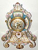 C.1890, French, Etienne Maxant, Paris, Porcelain China Clock in the style of Louis XV, white with hand painted floral decorations, pink and blue accents and gold highlights, also with decorated dial and gilt hands, retailed by Bailey Banks and Biddle, and with matched serial number pendulum.