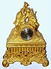 C.1830, French, Gilt Bronze figural clock, two lovers, a male playing the bag pipes, and the girl with her hands over his eyes as if asking him to guess who it is.