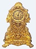 C.1830, French, Guyerdet Aine, Paris, rococo style gilt bronze figural clock, the case profusely decorated with shells and fruit and with lions paw feet, the well made silk thread susp movement signed by the maker, struck over the Pons-1827 award medallion.