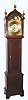 C.1900, English, for Theodore B. Starr, New York, rolling moon, time and strike brass dial tall clock, in an English oak case.