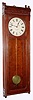 C.1890, E. Howard and Co., Boston, "Regulator No. 58" in cherry, full size, meter pendulum, 8-day weight driven.