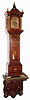 C.1900, English, Albert Barker, 5 New Bond St, London, Dwarf Tall Clock, mahogany, with profuse inlay, and on a shelf from the same period, with some Nouveau influence. The movement signed on the rear plate, "Made in France, especially for Albert Barker, London", and the dial signed as in the headline.
