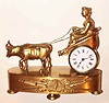 C.1870, French, Mini Figural clock, Lady in Ox Cart, 8-day timepiece, with small platform lever movement.