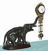 C.1905, German, ELEPHANT SWING, 8-Day novelty timepiece, the support bar for the clock held at the end of the elephant's trunk.