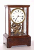C.1910, Eureka Clock Co., Ltd, London, Battery timepiece with large seconds beating balance, supported in ball bearings, in an oak case with 5 panes of beveled glass, movement serial No. 8632.