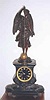 C.1880, French, Conical Pendulum Clock, the base of bronze and Belgian black slate, and the angel statue of patinated spelter, holding a detailed cast and gilded globe as the pendulum, signs of the Zodiac around the equator.