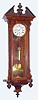 C.1875, Austrian, Jos Lipperl, Leoben, small 1-wt timepiece with a 5" dial, and in a walnut transitional case.