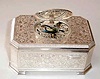 Late 20th Century, German/Swiss, singing bird box, key wound from bottom, in a silver plated embossed case.