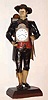 C.1900, German, CLOCK PEDDLER, now with key-wind Swiss watch movement and dial, figure in original paint, the peddler with a group of pendulums in his left hand. Entire statue is carefully formed segments of tin, soldered together and painted.