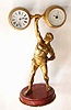 C.1895, French, Clock and Barometer, gilt bronze commemorative to EUGEN SANDOW, famous weight lifter and "father of modern weight lifting", retailed by Elkington and Co., Liverpool, each instrument held in the ends of a giant barbell. Sandow was born in 1867 in Konigsberg, Germany.