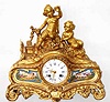C.1875, French, Ormolu Figural clock, PLAYING CHILDREN, showing a young boy and girl in the woods with a bird nest, holding one chick aloft and with an open bird cage to one side, ready to receive the new pet.
