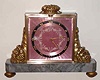 C.1920, Swiss, Gubelin, Lucerne, Ormolu and Marble time and strike desk clock, jeweled lever escapement, rear wind, striking on internal coiled wire gong. The dial with pale pink guilloche enamel.