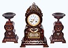 C.1830, French, Rosewood, 3-pc mantel set with inlays of brass and ivory, the well made movement with silk thread suspension, and actuating the calendar below by a vertical rod; with thumb screws to adjust the calendar at the end of short months, and two matching side pieces.