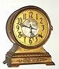 C.1910, Seth Thomas Clock Co., ELECT, metal cased mantel clock, brass drum on top with patinated spelter base, 8-day time and strike.