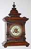 C.1900, German, Hamburg-American Clock Co., medium walnut mantel clock, 8-day time and gong strike with porcelain dial.