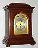 C.1910, German, Junghans, WESTMINSTER CHIME mantel clock, oak, with embossed brass dial with regulation in the arch for F/S and Chime-Silent.