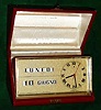 C.1980, Swiss/Italian, Robert Dessomville, calendar desk clock, 1.5v battery power, the clock made in Switzerland, the perpetual calendar and case made in Italy [plastic gears], in a silk lined and leather covered presentation box, the top of the clock engraved "Con un arrivederci in Italia", and with the months and days of the week showing in Italian.
