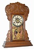C.1902, Waterbury Clock Co., AMHERST, pressed oak gingerbread, 8-day time and gong strike.
