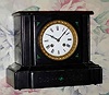 C.1900, French, Japy, Black Marble mantel clock with jade accents, 8-day time and gong strike.