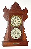 C.1894, Charles W. Feishtinger, Fritztown, Penn., 8-day time/strike double dial calendar gingerbread clock. Cases and movements were made by the Waterbury Clock Co., and later entirely made by Waterbury for Feishtinger. This example is the "Hendon" model.
