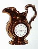 C.1890, English, Copper Loster Pitcher, with a clock face on one side, and a Japanese man in his garden on opposite side.