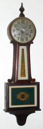 New Haven Clock Co., WARING model, 8-day spring banjo clock with green/ gold tablets. C.1928. — Antique Clocks Price Guide