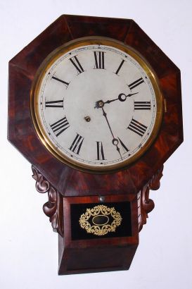 New Haven Clock Co, short drop octagon, chisel bottom wall clock, 8-day time, mahogany veneer case. C.1880. — Antique Clocks Price Guide