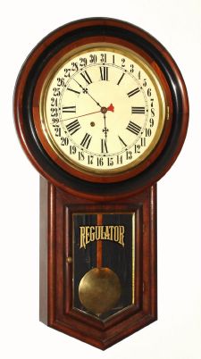 New Haven Clock Co., "No. 1 Time-Piece Regulator", round top, long drop walnut wall time and calendar clock, 8-day. C. 1900. — Antique Clocks Price Guide