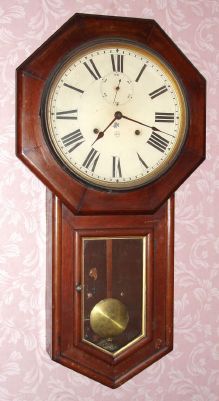 Seth Thomas Clock Co., WORLD model, 15-day long drop octagon timepiece in walnut. C. 1920. — Antique Clocks Price Guide