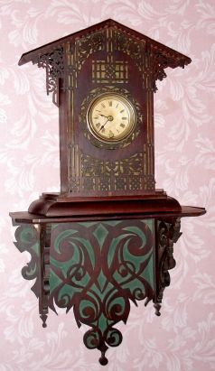American, Primitive fret work clock and shelf, dark walnut, with an 8-day pendulum movement, time only. C. 1890. — Antique Clocks Price Guide