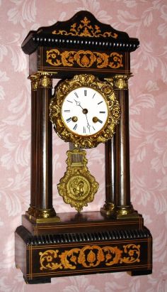 French, Vincenti and Cie, Empire style mantle clock with inlaid case and cast pendulum and bezel, 8-day bell strike. C. 1880. — Antique Clocks Price Guide