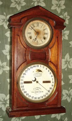 Ithaca Calendar Clock Co., "No. 7 SHELF COTTAGE", 30-day, time, double spring, walnut case, double dial perpetual calendar. C. 1874. — Antique Clocks Price Guide