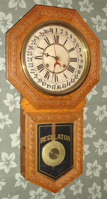 Sessions Clock Co., Forestville, Conn, "STAR POINTER", pressed oak, long drop octagon school calendar, 8-day time and strike, With E. N. Welch label on rear. C.1904. — Antique Clocks Price Guide