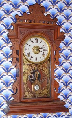 E. N. Welch Mfg. Co, "ERMINE", walnut gingerbread clock, time, gong strike and bell alarm, 8-day. C.1884. — Antique Clocks Price Guide