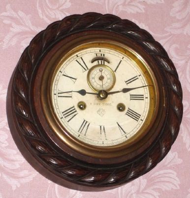 Ansonia Clock Co., "Five Inch Cable", with 8-day double spring time only movement, oak case with carved "cable" surround, and with seconds hand. C.1890,. — Antique Clocks Price Guide