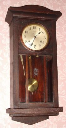 Waterbury Clock Co. "HANGING CHIME No. 236", dark mahogany cased Westminster Chime wall clock on rods, 8-day, spring. C.1923. — Antique Clocks Price Guide