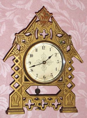 E. N. Welch Mfg., Forestville, Conn, CHALET, cast bronze case with pivoted pendulum movement, rear wind,, spring, 8-day. C.1880. — Antique Clocks Price Guide