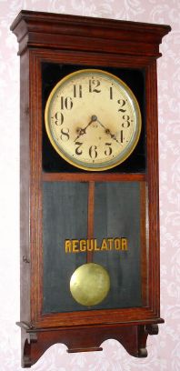 Sessions Clock Co, Forestville Conn, "REGULATOR NO. 1" model, 8 day time and strike brass mvt in oak case with 12" dial, spring driven. C. 1908. — Antique Clocks Price Guide