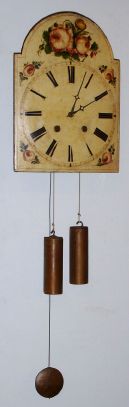 German, Wooden dial wag on the wall, 8-day, 2-wt time and gong strike, wooden plated movement, steel arbors and brass wheels, winds through the dial. C.1870. — Antique Clocks Price Guide