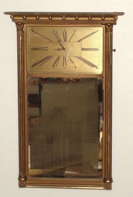 Waltham, Waltham Mass, Mirror clock with 8 day balance mvt (rugged car clock movement) in gilded case with 9 1/2"H x 15"W metal Art Deco style dial set above a looking glass. C. 1925. — Antique Clocks Price Guide