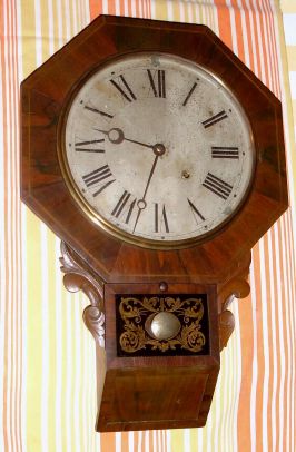 E. N. Welch, Forestville, Conn, "DROP OCTAGON NO. 2" model, 8 day time brass mvt in rosewood veneer case with 12" dial, spring driven. C. 1880. — Antique Clocks Price Guide