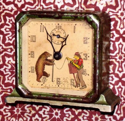 Keebler Clock Co., Philadelphia, PA, ORGAN GRINDER animated alarm clock, showing the grinders arm playing the organ briskly, opposite a bear in dance pose. C.1930. — Antique Clocks Price Guide