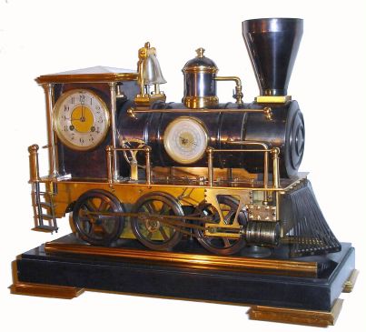 French, Automaton "LOCOMOTIVE", from the Industrial series, an 0-6-0 model with a bonnet smokestack, a clock in the cab portion, and a barometer in the boiler section, and with a working bell and prominent cow-catcher, the wheels powered by a separately wound and governed movement in the chassis area of the locomotive. C.1890. — Antique Clocks Price Guide