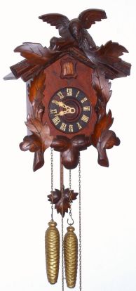 American Cuckoo Clock Co., Philadelphia, 1-day time and strike wall clock, 7 leaf and single bird pattern, the movements imported from Germany, cases made in PA. C.1910. — Antique Clocks Price Guide