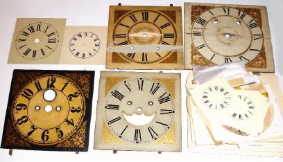 Box lot including a large assortment of modern paper dials and eight antique wooden dials in various states. — Antique Clocks Price Guide