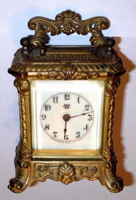 Waterbury Clock Co., CHAMPION, gilt white metal carriage clock, time, strike and repeat. C.1906. — Antique Clocks Price Guide