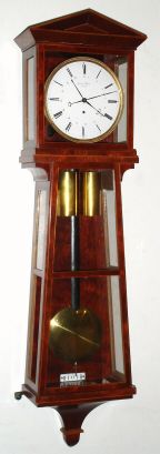 Viennese 30 Day calendar movement by Johann Worle, Wien, now in a later purpose made Laterndluhr case of uncommon 9-light keystone design, rich mahogany veneer with holly banding or edging. movement driven by two weights supported by a single wheel pulley with saddle, with maintaining power and early tapered pillars. And with old crank. C.1830. — Antique Clocks Price Guide