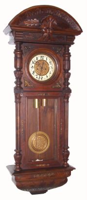 German, Gustav Becker (Freiburg), 2-wt "Vienna Regulator" in a walnut double door case with carved "northwind" top, 8-day rod strike. Serial No. 371496. C.1875. — Antique Clocks Price Guide